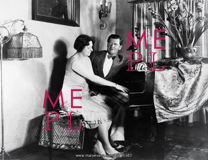 : Couple sitting at piano : Couple sitting at piano