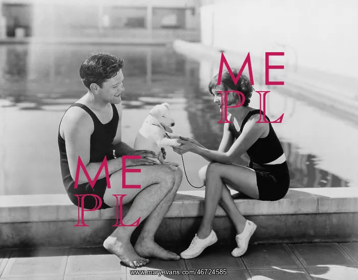 : Couple sitting with their puppy next to a pool : Couple sitting with their puppy next to a pool