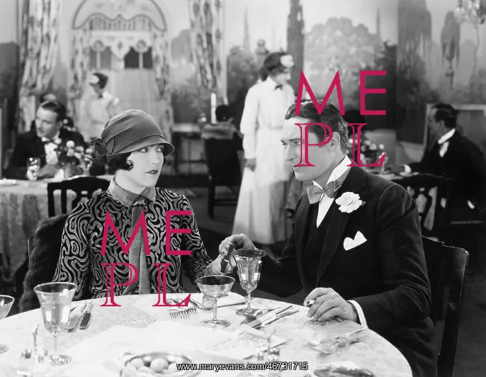 : Couple sitting together in a restaurant holding hands : Couple sitting together in a restaurant holding hands