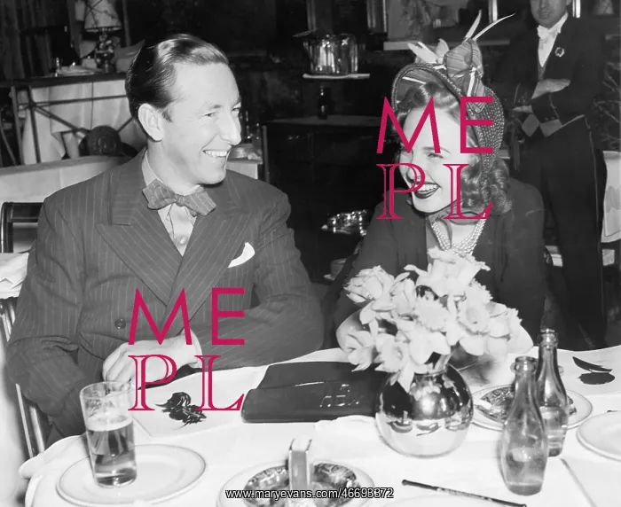  : Couple sitting together at a table having fun