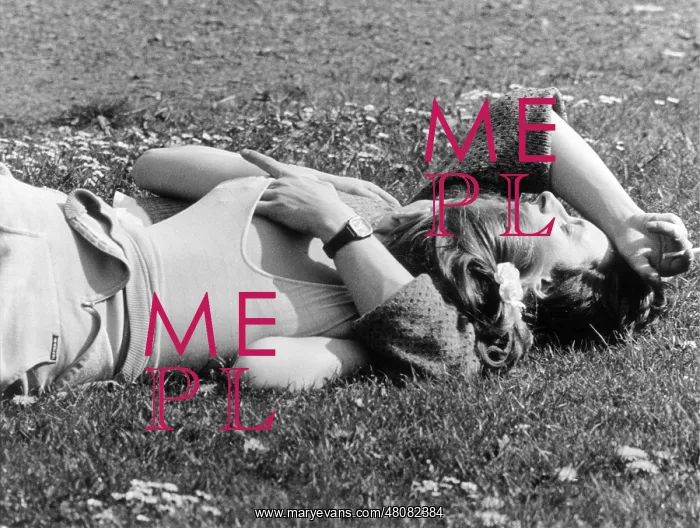  : Couple sunbathing on the grass