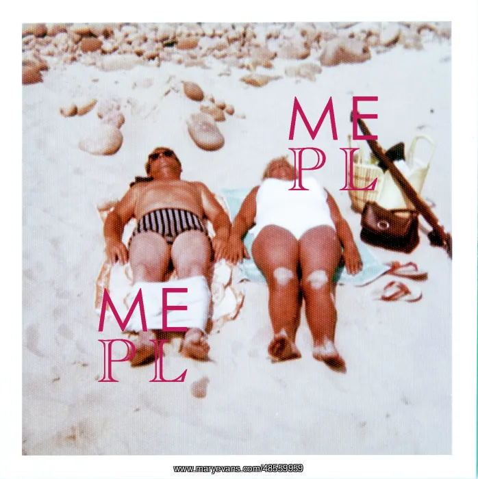 : Couple sunbathing on a sandy beach : Couple sunbathing on a sandy beach