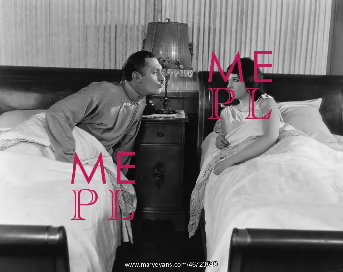: Couple in twin beds : Couple in twin beds