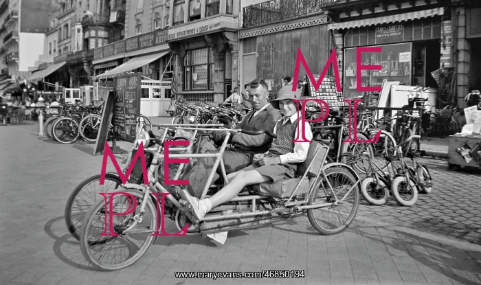 : Couple on a two-seater cycle, Belgium : Couple on a two-seater cycle, Belgium