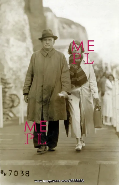 : Couple walking below the cliffs at Cliftonville, Kent : Couple walking below the cliffs at Cliftonville, Kent