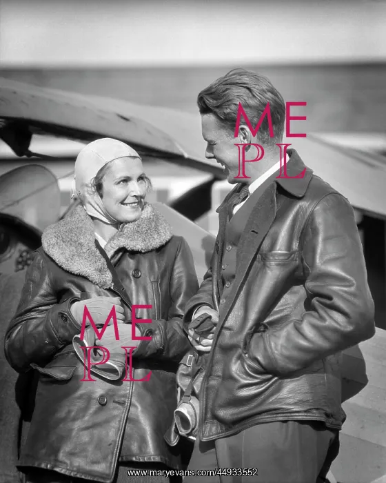 : Couple Wearing Leather Jackets Holding Goggles : Couple Wearing Leather Jackets Holding Goggles