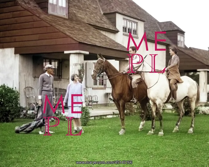 : Two Couples One on Horses the Other wearing Golf : Two Couples One on Horses the Other wearing Golf