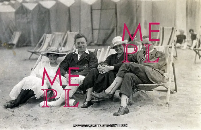 : Couples sit in deckchairs on the beach at Margate, Kent : Couples sit in deckchairs on the beach at Margate, Kent