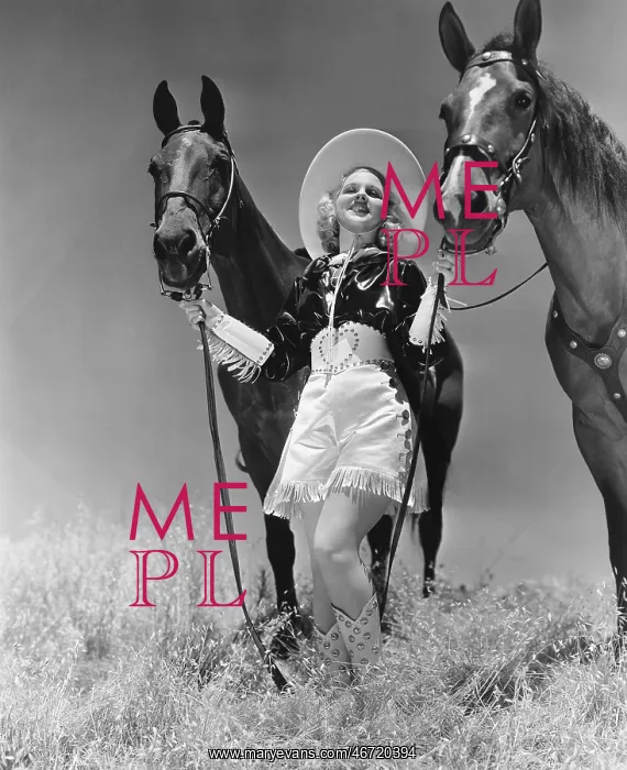  : Cowgirl with two horses