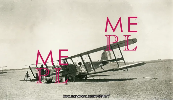 : Crashed biplane with crew resting in the desert, Iraq : Crashed biplane with crew resting in the desert, Iraq