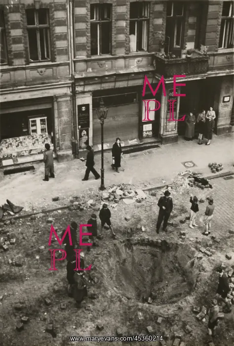 : Crater made by British bomb dropped into downtown : Crater made by British bomb dropped into downtown