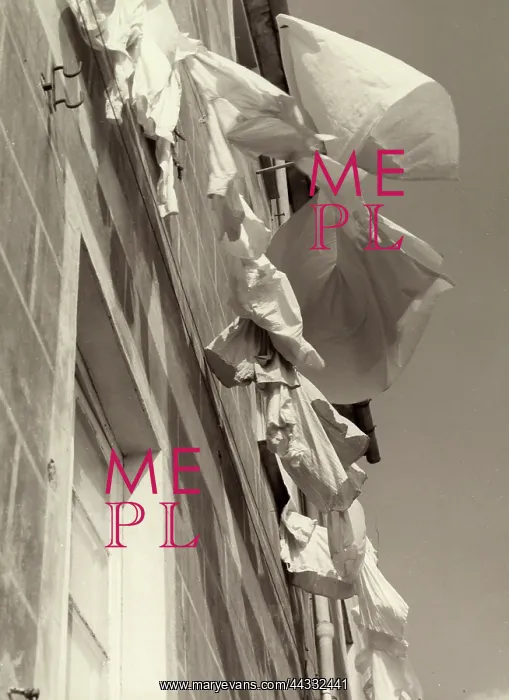 : Creative. Linens hanging outside a house. The photograph is taken from below : Creative. Linens hanging outside a house. The photograph is taken from below