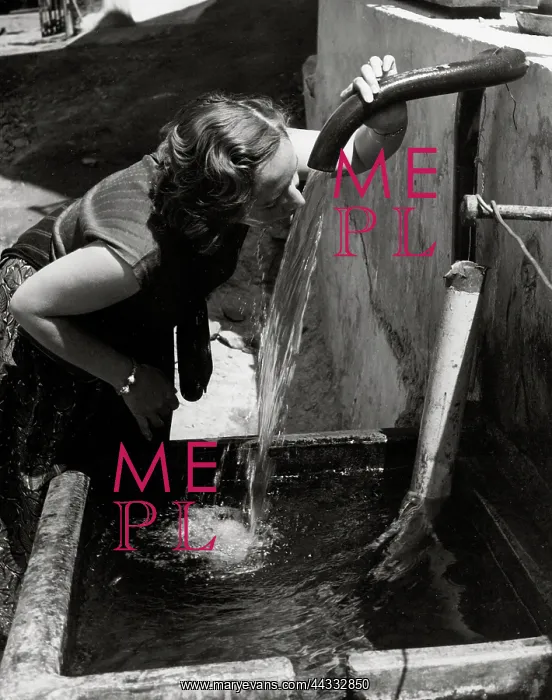 : Creative. Young woman drinks at a fountain : Creative. Young woman drinks at a fountain