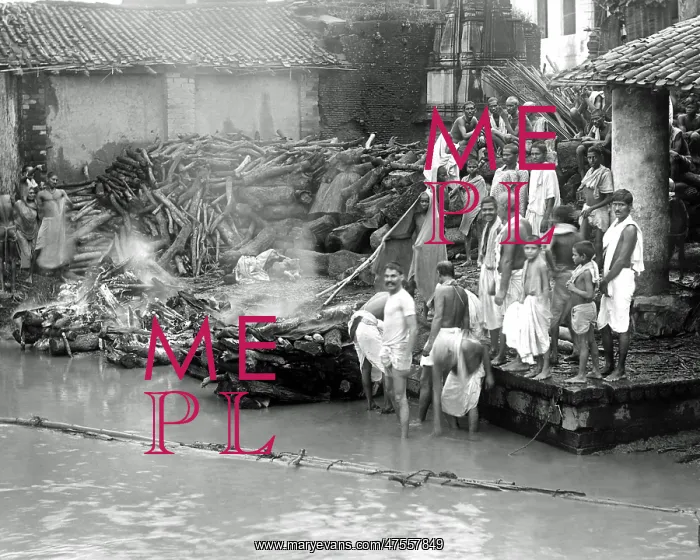  : Cremating bodies at the waterside, India