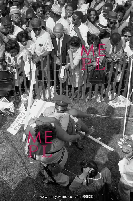: A crowd of African Americans behind a fence : A crowd of African Americans behind a fence