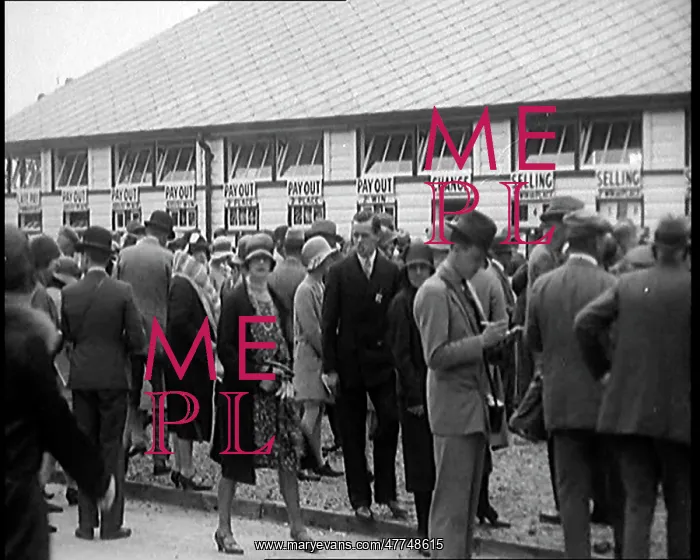 : A Crowd of People Standing Outside A Totaliser / Tote : A Crowd of People Standing Outside A Totaliser / Tote