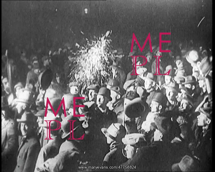 : A Crowd of People Wave at a Spotlight Which : A Crowd of People Wave at a Spotlight Which
