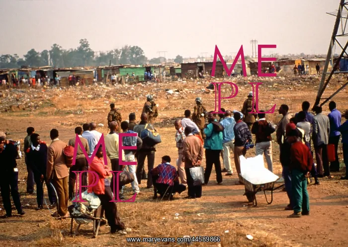 : Crowd, some with possessions in wheelbarrows : Crowd, some with possessions in wheelbarrows