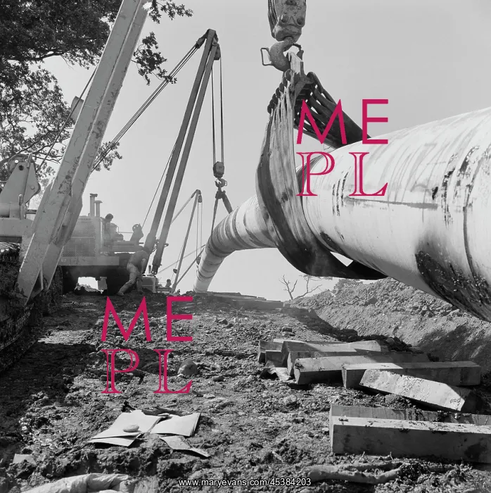  : Cumbria. A view of pipelaying equipment lowering the Brampton pipeline into a trench