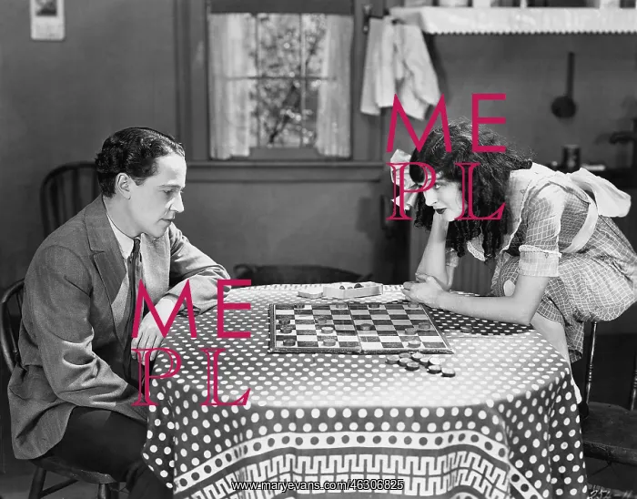 : Cuople playing checkers or draughts : Cuople playing checkers or draughts