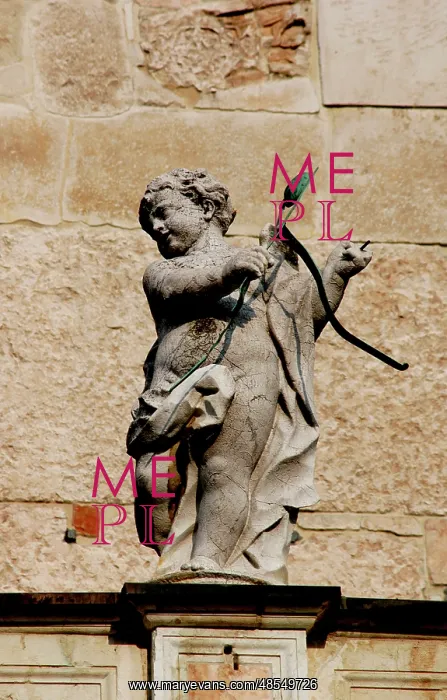 : Cupid with bow and arrows. Sculpture. Facade of the Duomo in : Cupid with bow and arrows. Sculpture. Facade of the Duomo in