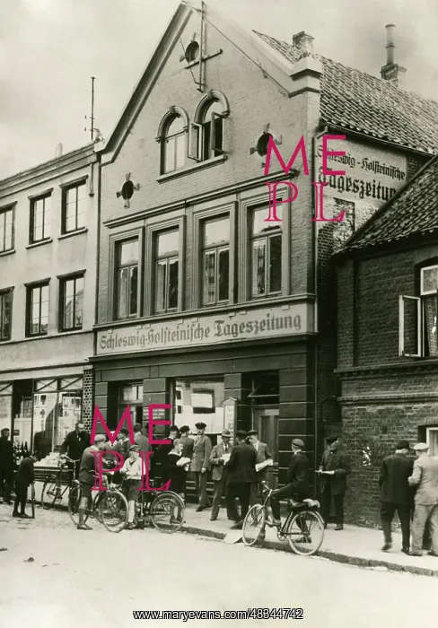 : Curious people in front of buildings of the : Curious people in front of buildings of the
