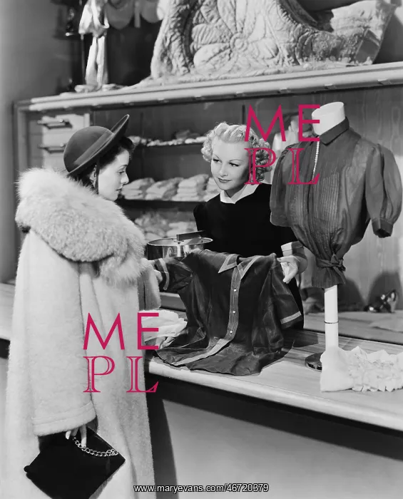 : Customer and clerk in clothing store : Customer and clerk in clothing store