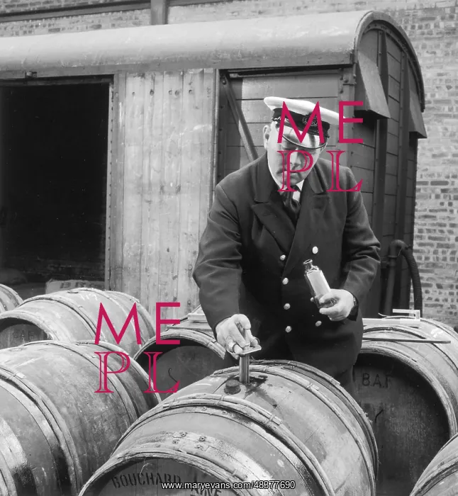 : Customs official tests imported wine : Customs official tests imported wine