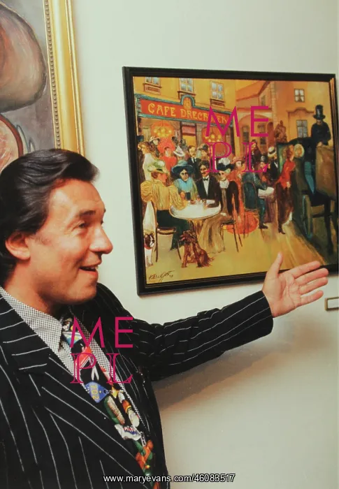 : The Czech singer Karel Gott with one of his paintings : The Czech singer Karel Gott with one of his paintings