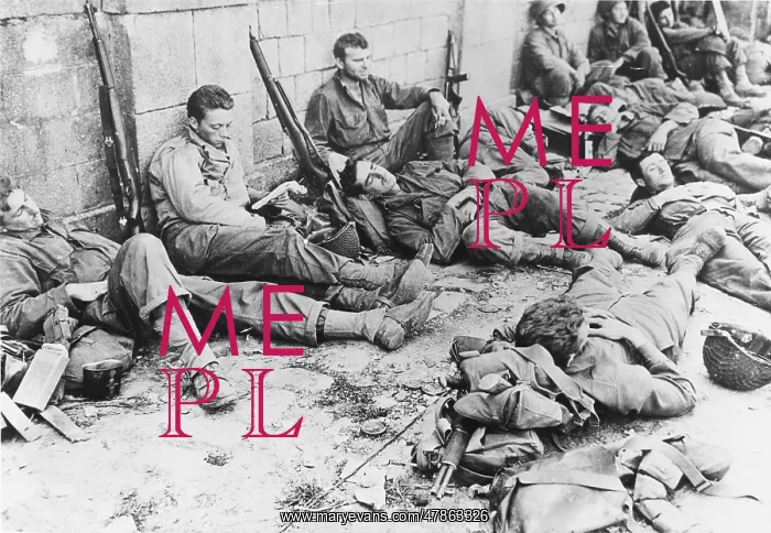 : D-Day - US Troops resting following initial assault : D-Day - US Troops resting following initial assault