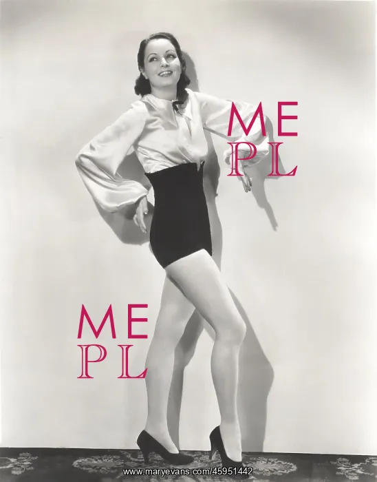 : Dancer posing in high-waisted shorts and silk blouse : Dancer posing in high-waisted shorts and silk blouse