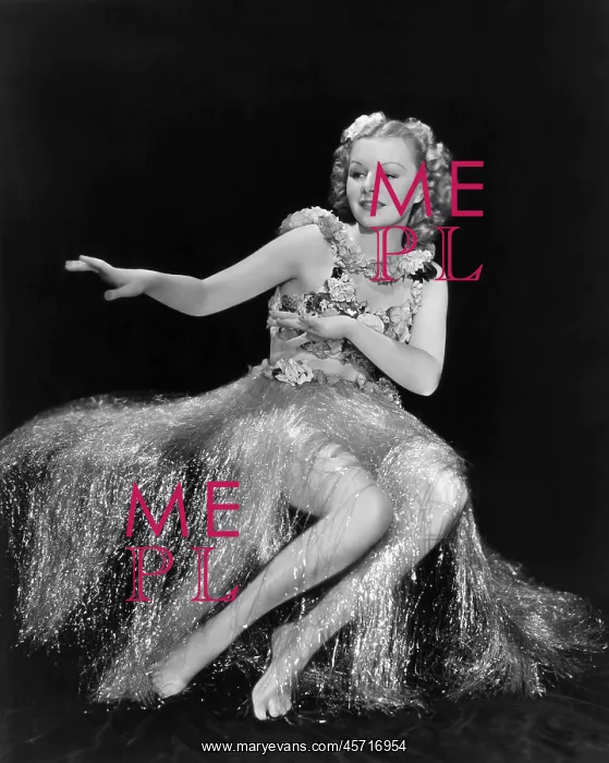  : Dancing the hula in a tinsel skirt