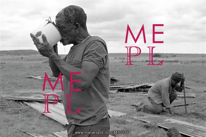: Daniel Molefe quenching his thirst after working to : Daniel Molefe quenching his thirst after working to