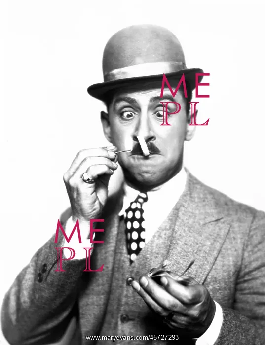 : Dapper man having difficulty lighting his cigarette : Dapper man having difficulty lighting his cigarette