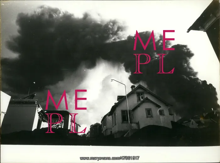 : Dark, ominous smoke above houses : Dark, ominous smoke above houses