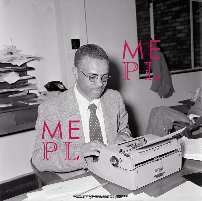 : NO DATE - Ezekiel Mphahlele, typing on a typewriter : NO DATE - Ezekiel Mphahlele, typing on a typewriter