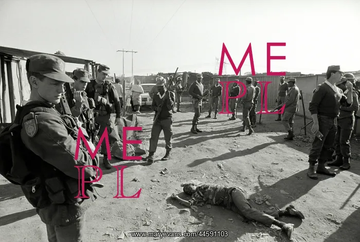 : The dead body of a young black man lies in the : The dead body of a young black man lies in the