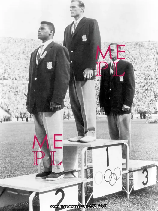 : Decathlete Bob Mathias (center), receiving ? : Decathlete Bob Mathias (center), receiving ?