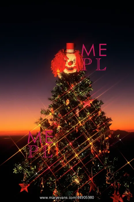 : Decorated christmas tree with clown on top : Decorated christmas tree with clown on top