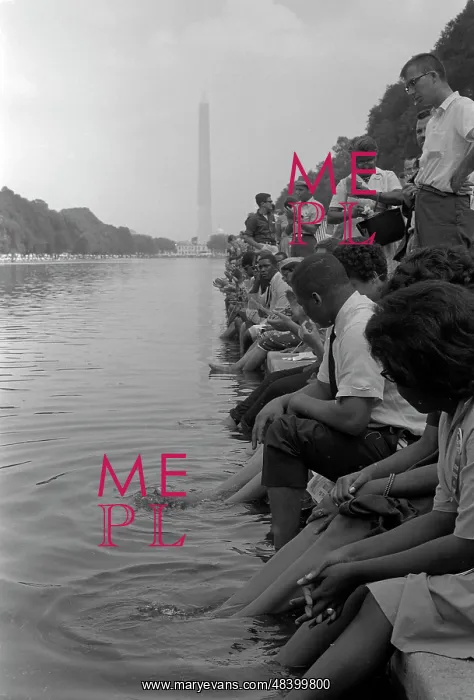 : Demonstrators sit along the Reflecting Pool : Demonstrators sit along the Reflecting Pool