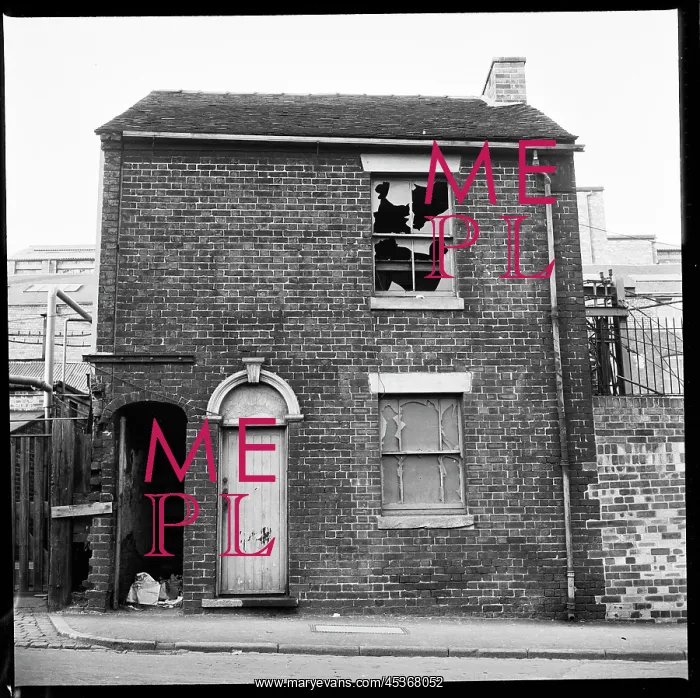 : A derelict house with industrial complex in the background : A derelict house with industrial complex in the background