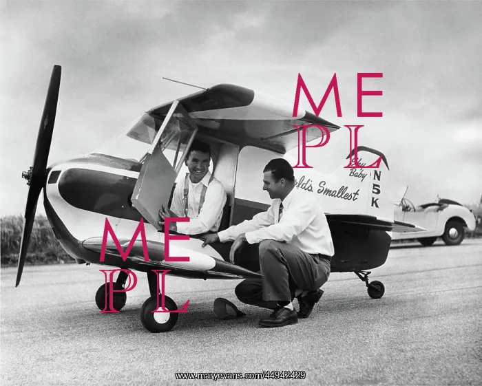 : Designer Ray Stits Kneeling by and Test-Pilot Bob ( Robe? : Designer Ray Stits Kneeling by and Test-Pilot Bob ( Robe?