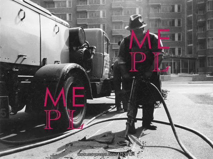 : Digging up the tarmac on a road : Digging up the tarmac on a road