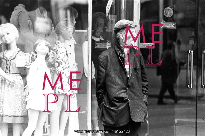 : A dishevelled man in front of clothes shop dummies : A dishevelled man in front of clothes shop dummies