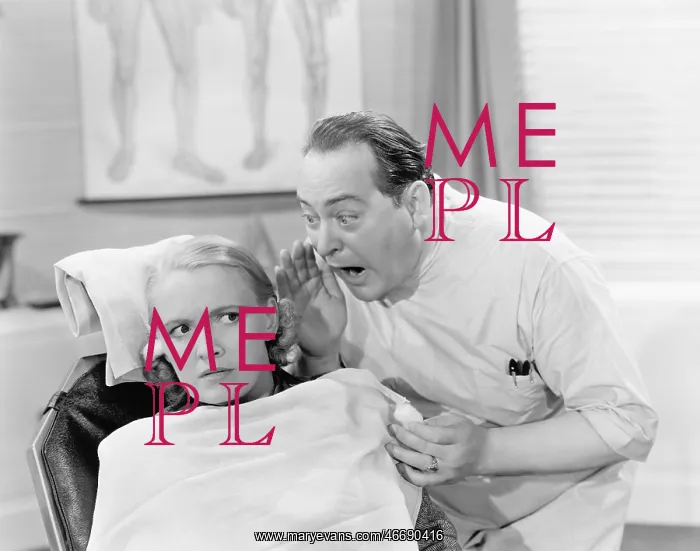 : Doctor shouting into the ear of a patient : Doctor shouting into the ear of a patient