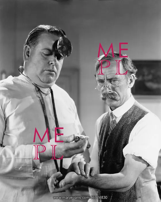 : Doctor taking mans pulse : Doctor taking mans pulse
