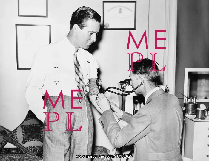  : Doctor taking a patients blood pressure