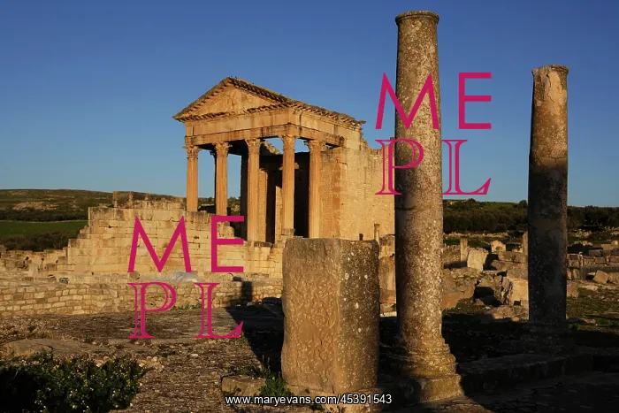 : Dougga. General view of the Roman Capitol with columns in the foreground : Dougga. General view of the Roman Capitol with columns in the foreground