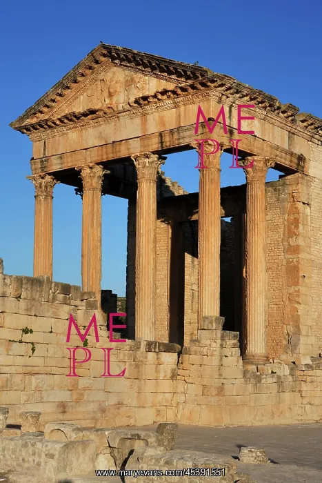 : Dougga. Low angle view of the Roman Capitol, 2nd century : Dougga. Low angle view of the Roman Capitol, 2nd century
