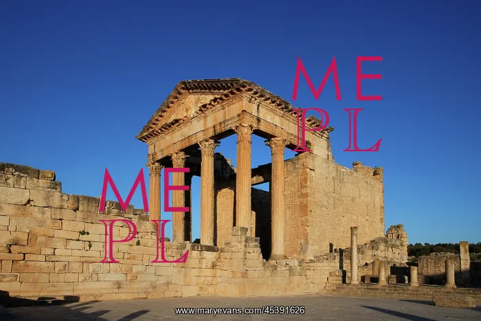 : Dougga. Low angle view of the Roman Capitol, 2nd century : Dougga. Low angle view of the Roman Capitol, 2nd century